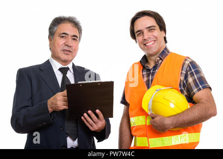 Persan senior businessman holding clipboard avec de jeunes Pe Banque D'Images