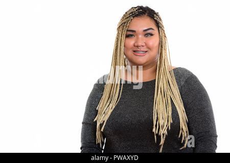 Studio shot of young woman smiling happy fat Banque D'Images