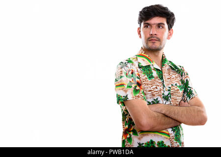 Portrait of young man thinking Persique with arms crossed Banque D'Images