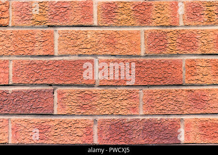 Vieux mur de briques rouges dans la lumière du soleil, une texture de fond photo Banque D'Images