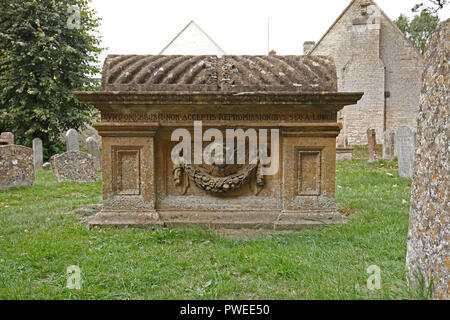 Rouleau de laine en tête tombe St John the Baptist Church, Burford, Oxfordshire, UK Banque D'Images