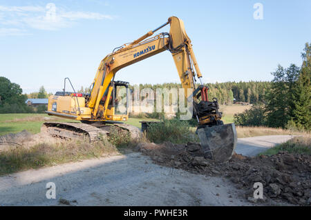 Pose de câbles électriques souterrains Digger Banque D'Images