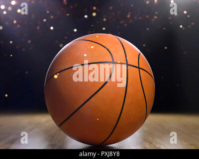 Basket-ball close-up sur fond noir avec le bokeh, spots Banque D'Images