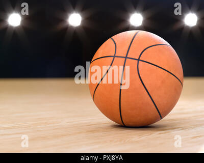 Basket-ball close-up sur fond noir avec le bokeh, spots Banque D'Images