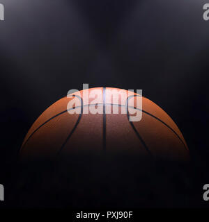 Basket-ball close-up sur fond noir avec le bokeh, spots Banque D'Images