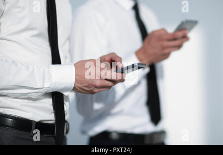 Perdre des téléphones dans les mains Banque D'Images