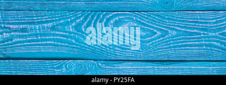 Arrière-plan de texture en bois avec le reste de l'ancien bleu et violet de la peinture. Étroit. Banque D'Images