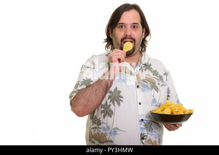 Portrait de barbu fat man eating chips Banque D'Images