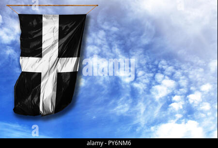 Pavillon de St Piran. Drapeau vertical, contre le ciel bleu avec place pour votre texte Banque D'Images