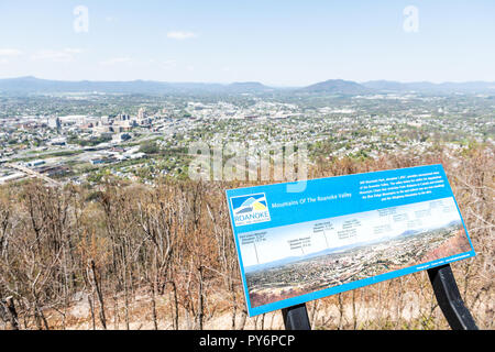 Roanoke, USA - April 18, 2018: Aerial Cityscape Skyline Panoramic panorama view of city in Virginia during spring with sign, mountains, during sunny d Banque D'Images