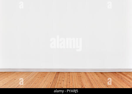 White wall background avec plancher en bois Banque D'Images
