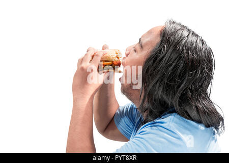 Portrait of asian fat man eating hamburger posing isolated over white background. Fat Man concept de régime Banque D'Images