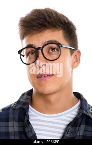 Face of young man wearing eyeglasses en pensant Banque D'Images