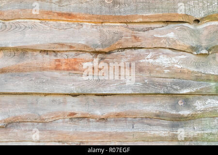 Vieux Mur de planches de bordure se chevauchaient les uns sur les autres comme un arrière-plan Banque D'Images