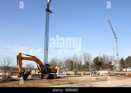 Pelle creuser sur nouveau bâtiment construction site Banque D'Images