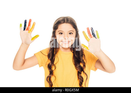 Beautiful happy kid montrant peint coloré mains and smiling at camera isolated on white Banque D'Images