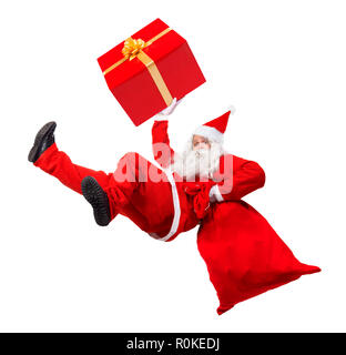 Funny Santa Claus falls avec un sac rempli de cadeaux de Noël. Santa Claus se précipiter donner des cadeaux à Noël. Tomber Santa Sack et transporter boîte-cadeau. Banque D'Images