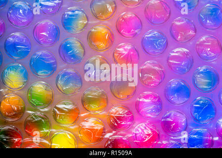 Abstract close up bubble wrap feuille avec fond coloré Banque D'Images