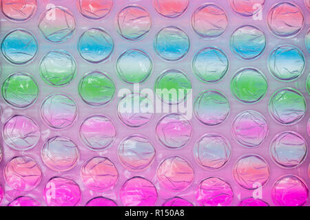 Abstract close up bubble wrap feuille avec fond coloré Banque D'Images