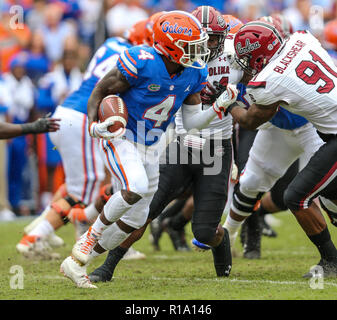 Nov 10 - Gainesville, FL, États-Unis : Florida Gator d'utiliser de nouveau Kadarius Toney (4) exécute la balle au cours de la première moitié d'un NCAA football match contre les Gamecocks Caroline du Sud à l'Université de Floride. (Gary Lloyd McCullough/Cal Sport Media) Banque D'Images