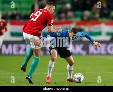 Budapest, Hongrie. 15 novembre, 2018. (L-r) Adam Szalai de Hongrie se bat pour la balle avec Artur Pikk de l'Estonie au cours de la phase de groupes de la Ligue des Nations Unies l'UEFA match entre la Hongrie et l'Estonie de Groupama Arena le 15 novembre 2018 à Budapest, Hongrie. Credit : Laszlo Szirtesi/Alamy Live News Banque D'Images