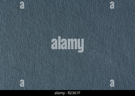 La texture du papier gris foncé sur fond macro. Banque D'Images