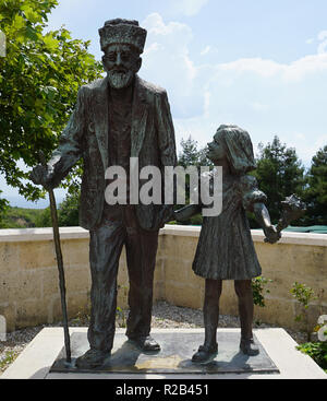 Statue de l'homme et avec ses petits-enfants Banque D'Images