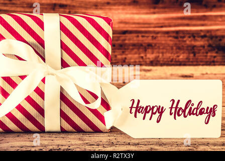 Un cadeau de Noël, la calligraphie anglaise Happy Holidays Banque D'Images