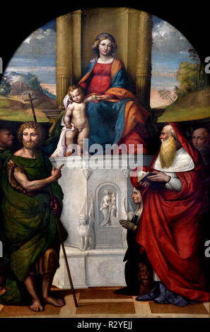 La Madonna col bambino dans trono - La Vierge et l'enfant ont intronisé 1517 Saints Jean-Baptiste, Gerolamo, François d'Assise, Saint Antoine de Padoue et le donateur Ludovica Trotti (connu sous le nom de ' Madonna del Pilastro Garofalo - Benvenuto Tisi (ou l'Il Garofalo) (1481 - 1559, l'Italie, l'italien. Banque D'Images