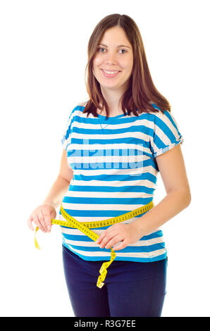 Pregnant woman measuring her waist Banque D'Images