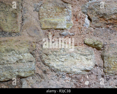 La texture de la pierre, à la surface du mur d'un bâtiment ancien. Banque D'Images