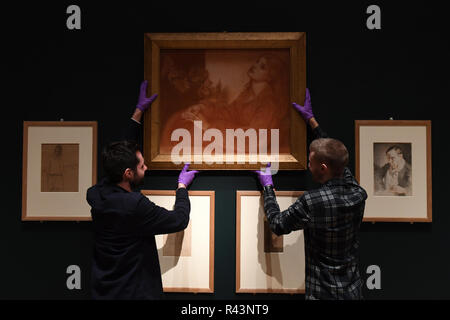 Les techniciens Galerie Richard Carpenter (à gauche) et Niall Automne installer moi Ricorditi di che fils la Pia (du purgatoire de Dante) par 19e siècle artiste Dante Gabriel Rossetti, au Fitzwilliam Museum de Cambridge. Banque D'Images