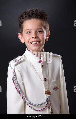 Young boy smiling in sa Première Communion Banque D'Images