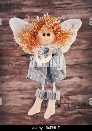 Angel figurine on a wooden background Banque D'Images