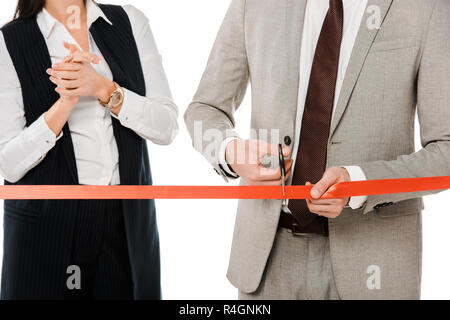 Portrait d'entrepreneurs ruban rouge de coupe avec des ciseaux pour inauguration, isolated on white Banque D'Images