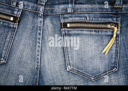 Denim bleu jeans usés texture avec une poche arrière et fermeture éclair. Abstract background texture jeans Banque D'Images