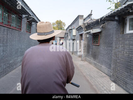En conducteur de pousse-pousse dans le quartier de Hutong Beijing Banque D'Images