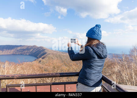 Woman taking photo piscine Banque D'Images