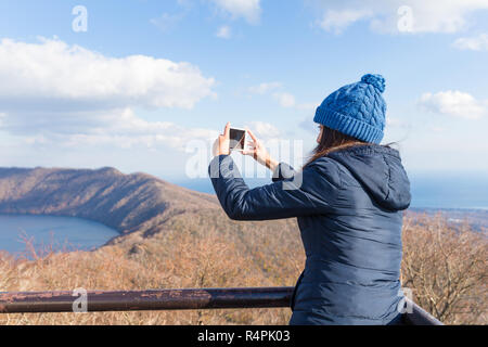 Woman taking photo piscine Banque D'Images