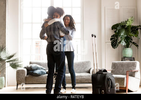 Happy African American family together in living room Banque D'Images