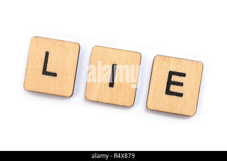 Le mot mensonge, de l'épeautre avec des lettres. Banque D'Images