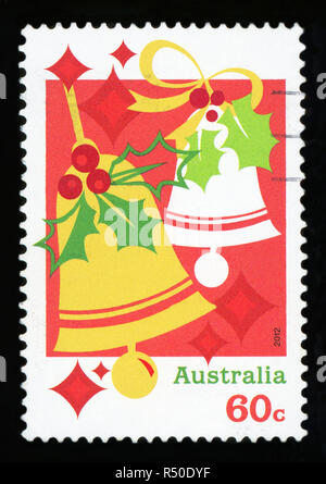 L'AUSTRALIE - circa 2012 : un timbre-poste utilisé à partir de l'Australie, qui représente une illustration de cloches de Noël et présente, célébration de Noël, vers 2 Banque D'Images