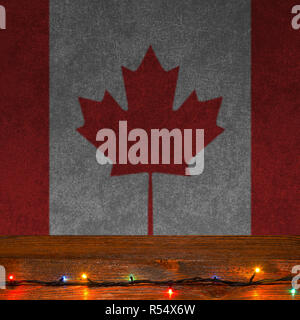Grunge fond festif avec des lumières de Noël sur une surface en bois et drapeau canadien Banque D'Images