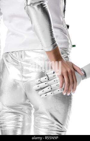 Portrait de femme robot arrêt touchant ses fesses isolé sur blanc, avenir technologie concept Banque D'Images