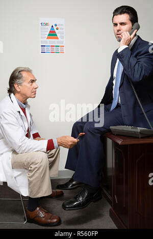 Businessman having a medical Banque D'Images