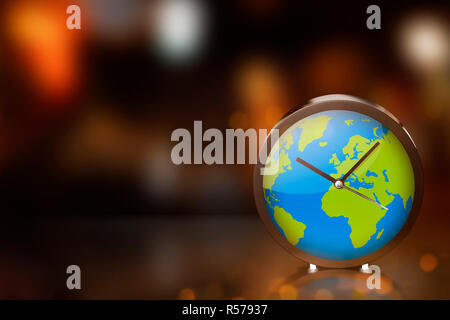 L'horloge de la terre avec la lumière floue sur dark room Banque D'Images