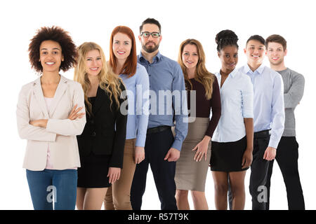 Les étudiants du Collège multiraciale Smiling Standing In Row Banque D'Images