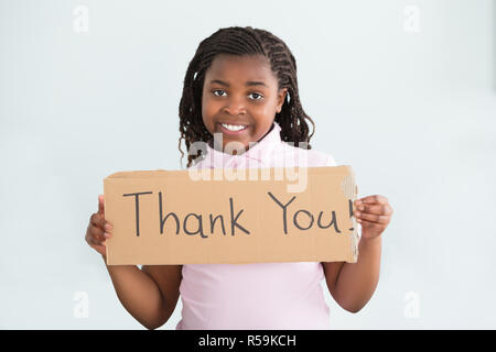 Girl Holding Merci Sign Banque D'Images