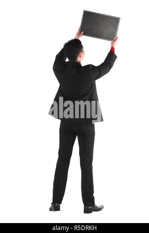 Young business man holding chalk board Banque D'Images