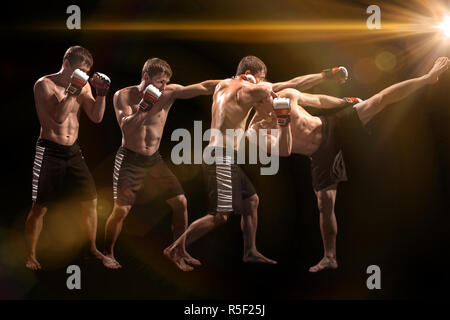 Male boxer boxing sac de frappe dans l'éclairage dramatique avec edgy dans un studio sombre Banque D'Images